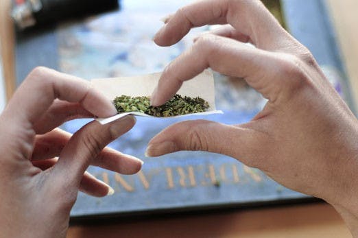 A marijuana user, who wished to remain anonymous, rolls a joint on Monday in honor of 4/20. April 20 is generally considered a holiday for marijuana users.