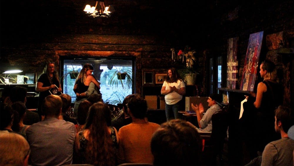 News Editor Madison Spratto and Editor-in-Chief Elizabeth Sanchez embrace at the Daily Lobo's end of the year barbecue at the Albuquerque Press Club, April 28, 2018.&nbsp;