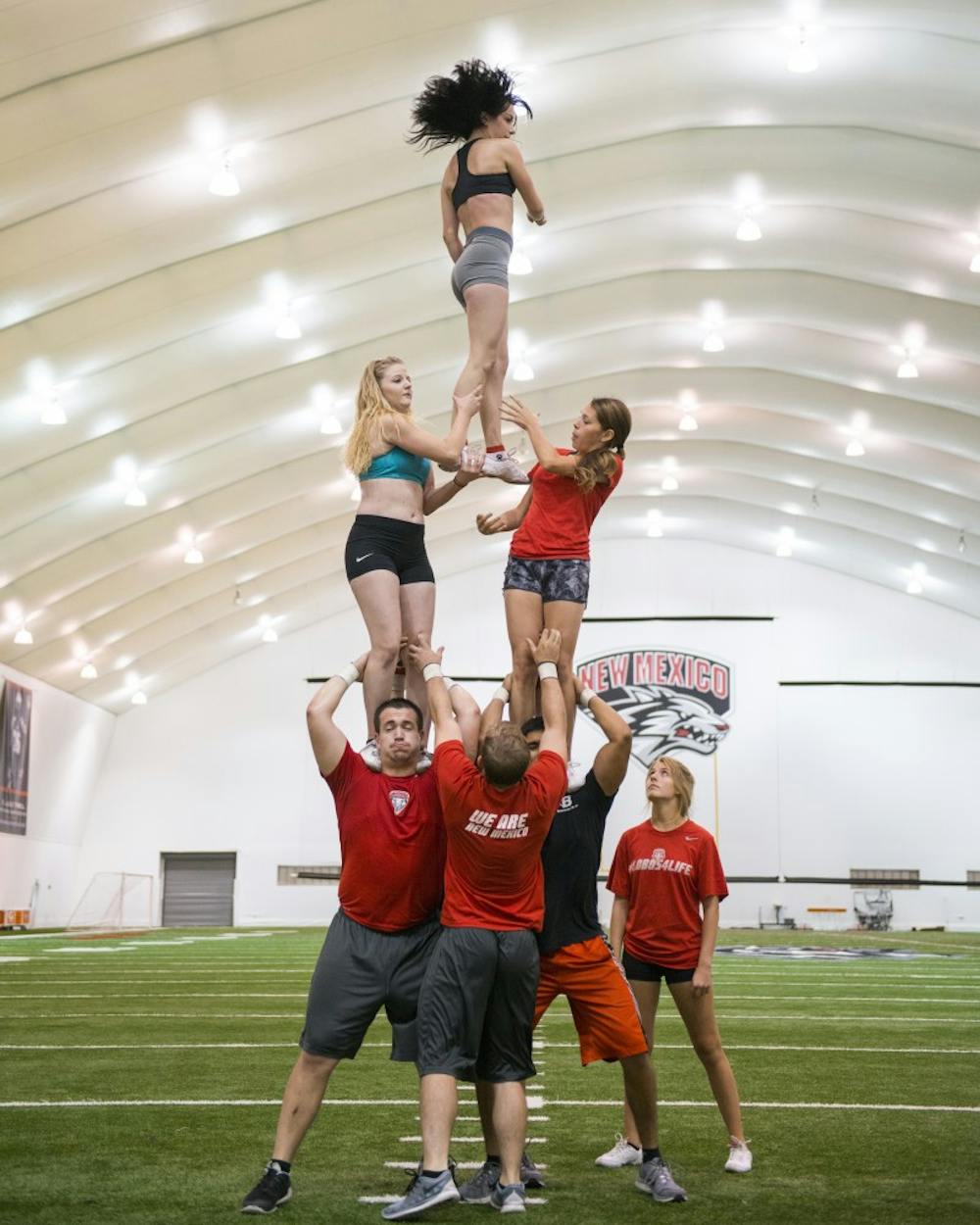 The New Mexico spirit squad practices drills at the Football Indoor Practice Facility Aug. 9, 2015.
