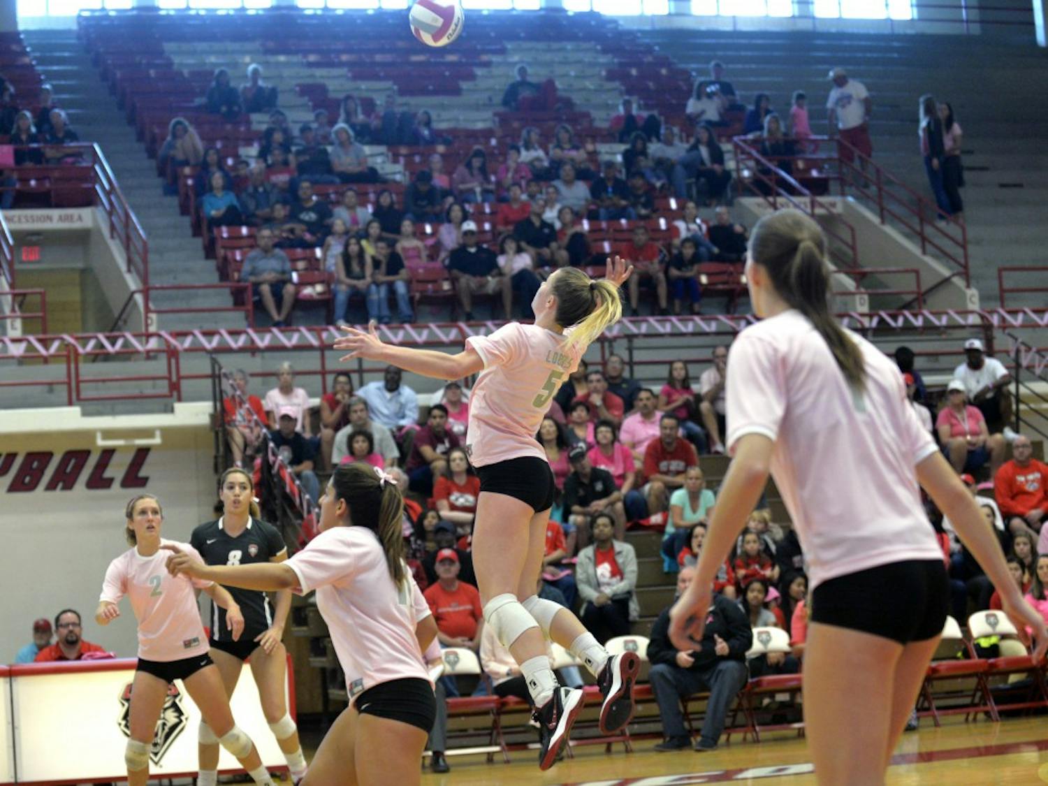 Outside hitter Julia Warren (5) leaps into the air for the ball at Johnson Center while playing against UNLV Saturday, Oct. 17, 2015. The Lobos lost to San Diego 2-3 on Saturday, Oct. 24.
