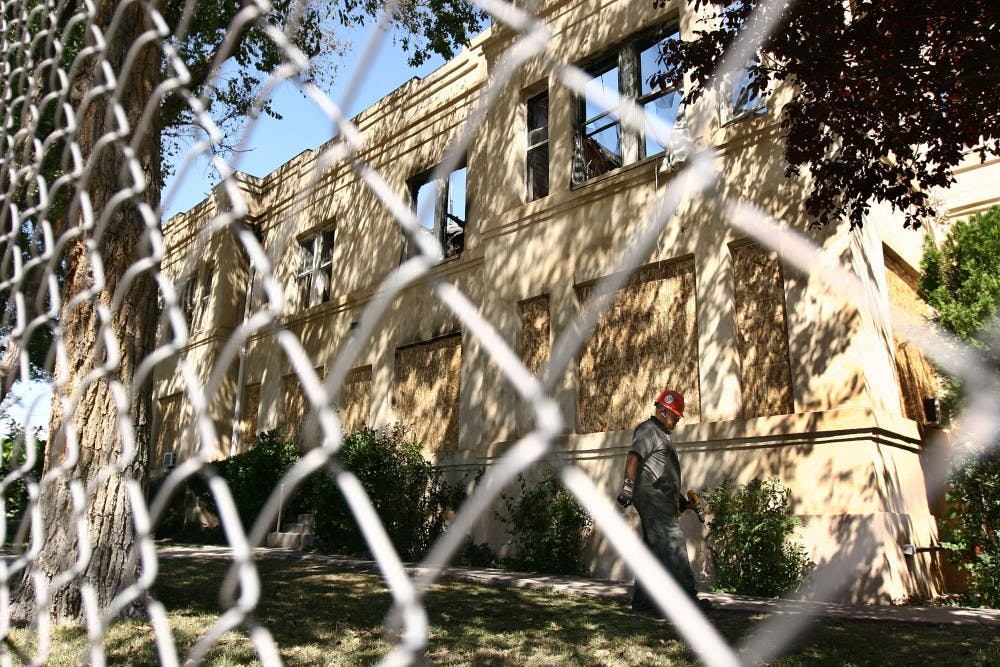 	Private Investigator Richard Skinner looks over the property at the Castle Apartments on Thursday. A UNM professor and student are seeking University assistance after losing their belongings in the fire.