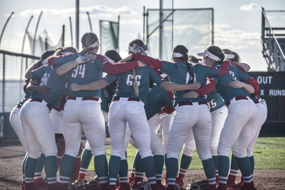 The UNM Woman's Softball team huddles before a game on&nbsp;Friday, March 30, 2018.