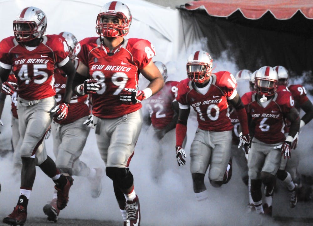 	The New Mexico football team makes an entrance onto University Stadium before the start of the game against UNLV last September. The Lobos’ 2014 season kick-off begins on Saturday at 6 p.m. against UTEP at University Stadium.