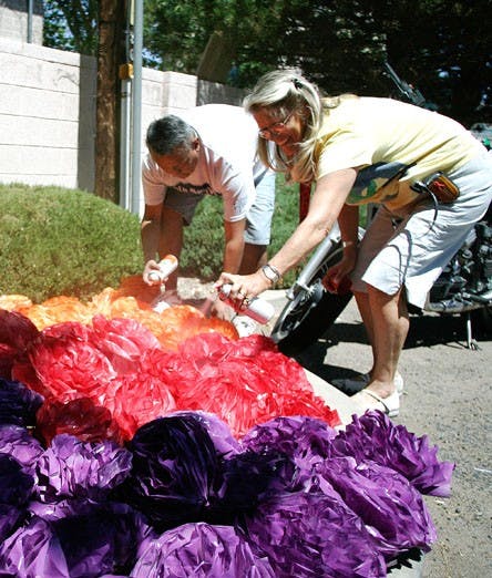 Ingrid Kloet, right, and Kory Montoya make decorations for a gay pride parade at the First Nations Community Healthsource on June 13. Kloet is an HIV/AIDS case manager at First Nations. 
