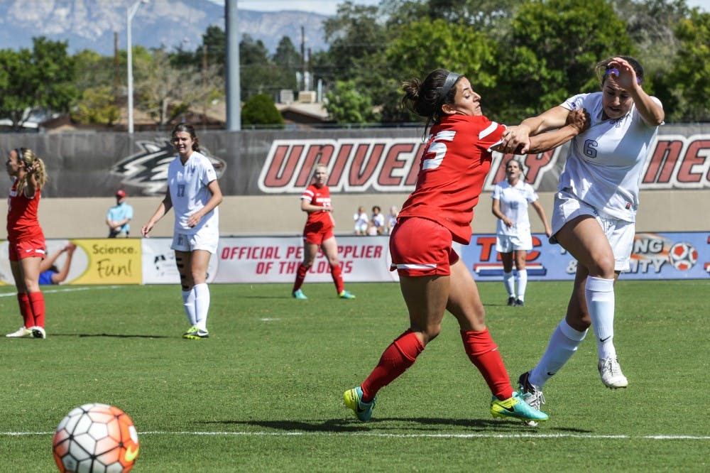 Senior defender Olivia Ferrier pushes a Air Force player after trying to defend the ball on Sunday, Sept. 25, 2016 at the UNM Soccer Complex.&nbsp;