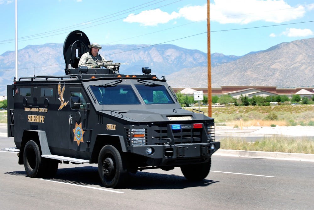 	Members of the Bernalillo County Sheriff’s Department SWAT team arrive at the scene of the Emcore shooting near Eubank Boulevard and Gibson Avenue on July 12. Summer Little, program manager for the UNM Women’s Resource Center, said the center is anticipating an increase in calls after the shooting.