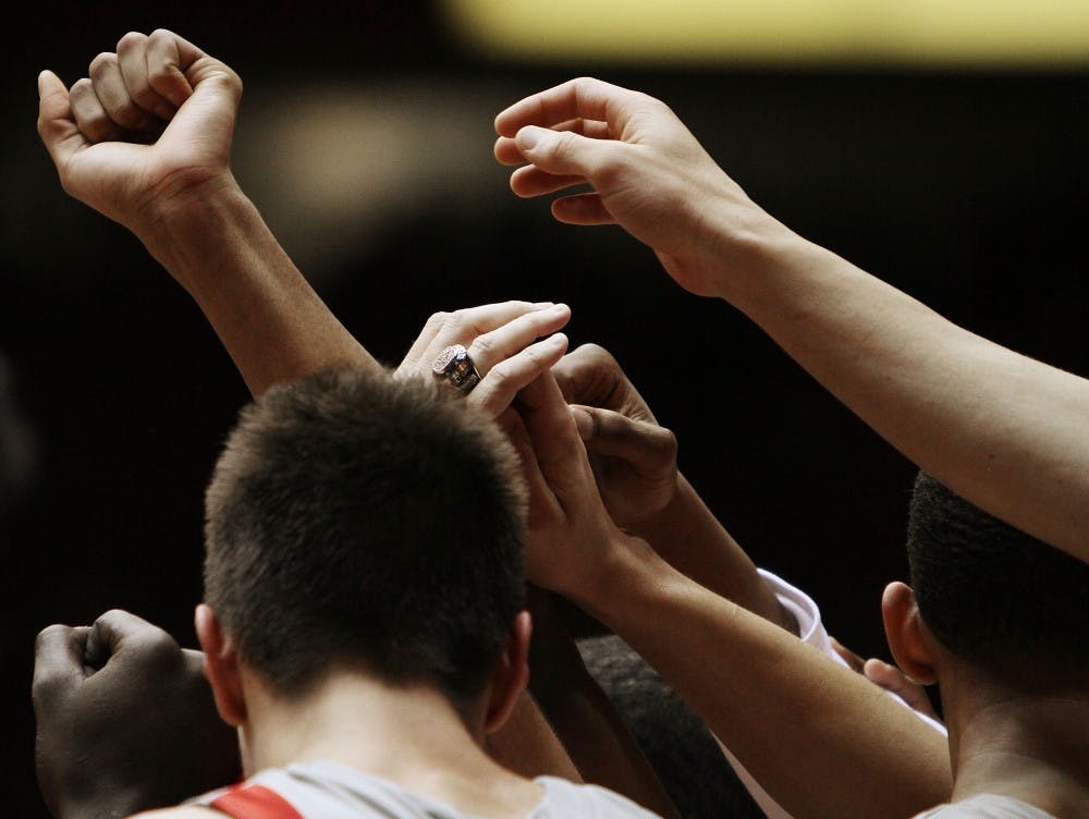 	Roman Martinez raises his hand after breaking from a huddle during a timeout in this file photo. The Lobos will face San Diego State on Saturday at The Pit.