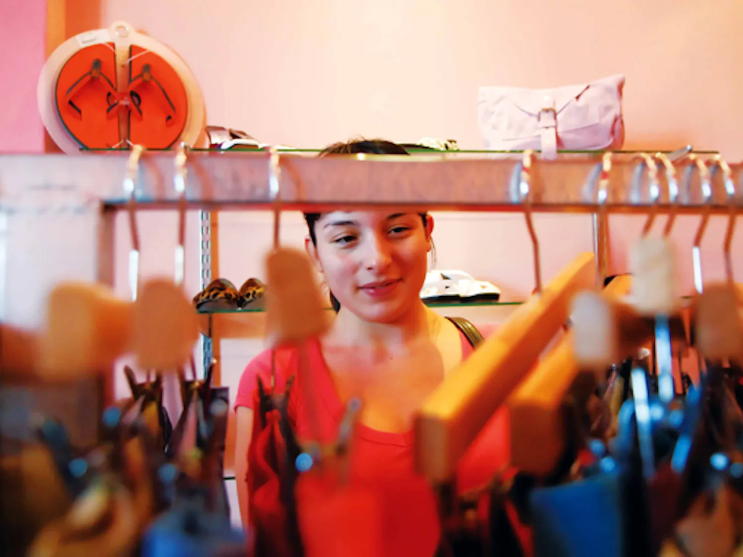 Student Mari Ordonez looks through a rack of pants at 2 Time Couture, at 600 Central Ave. S.E., on Tuesday.