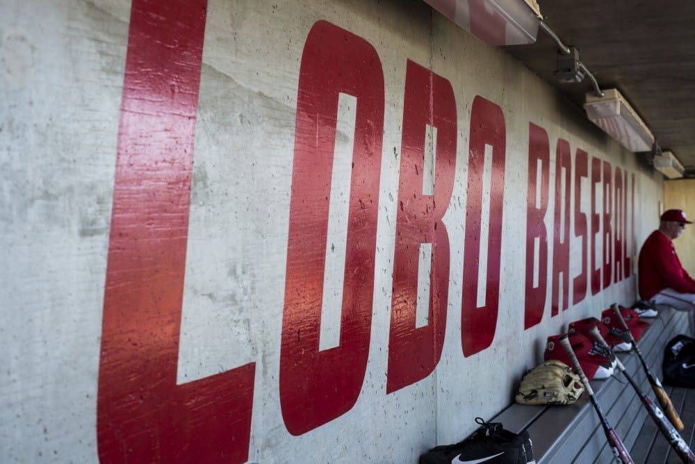 University of New Mexico head baseball coach Ray Birmingham sits against the wall of the home dugout at Santa Ana Star Field during the Lobos annual media day on Feb. 9, 2018. The Lobos open the season this Friday against Oregon State.