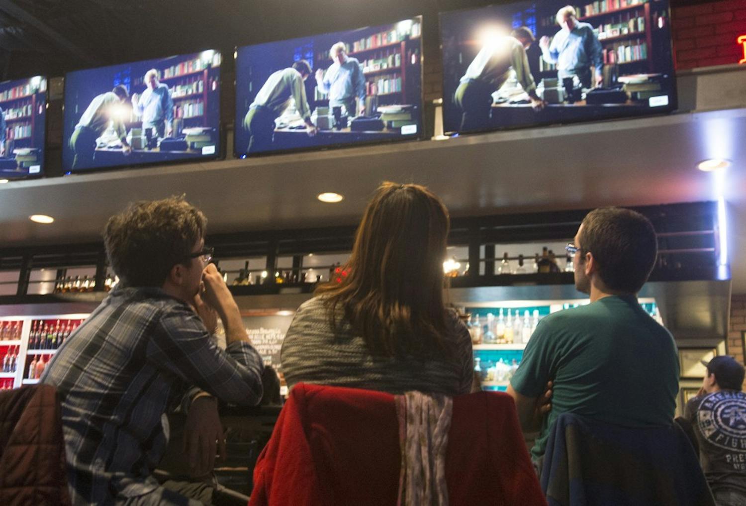Eric McMahon, Sora McMahon and Arty Fisk, right to left, watch the premier episode of Better Call Saul at The Local Brewhouse on Sunday. Better Call Saul, the Breaking Bad spinoff filmed in Albuquerque, focuses the unsuccessful life of lawyer Saul Goodman. 