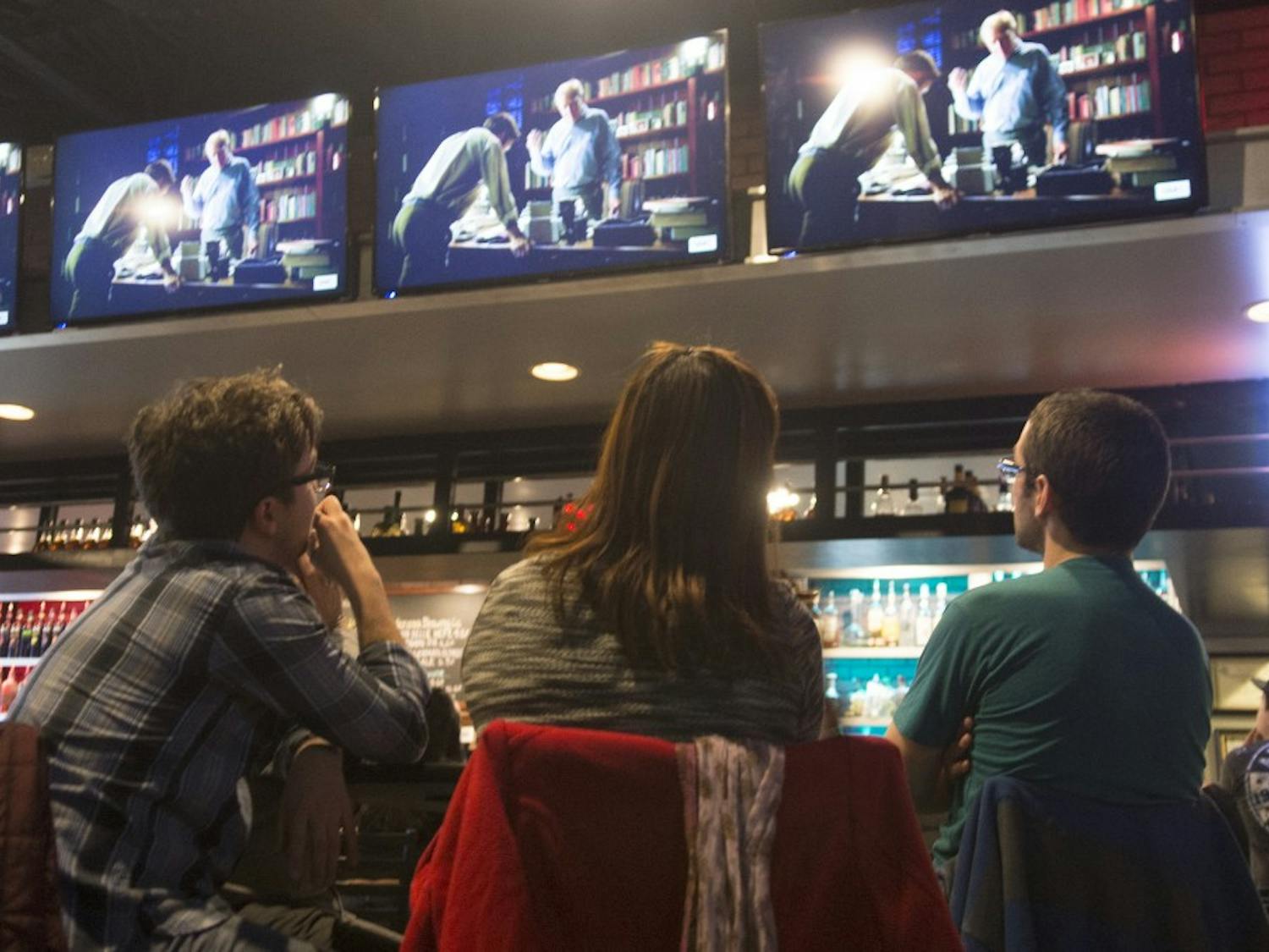Eric McMahon, Sora McMahon and Arty Fisk, right to left, watch the premier episode of Better Call Saul at The Local Brewhouse on Sunday. Better Call Saul, the Breaking Bad spinoff filmed in Albuquerque, focuses the unsuccessful life of lawyer Saul Goodman.