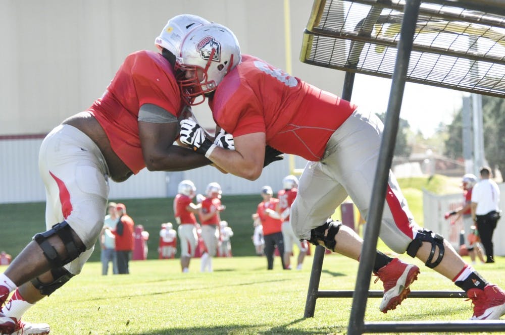 Redshirt senior offensive lineman Garrett Adcock practices drills Wednesday morning at University Stadium.