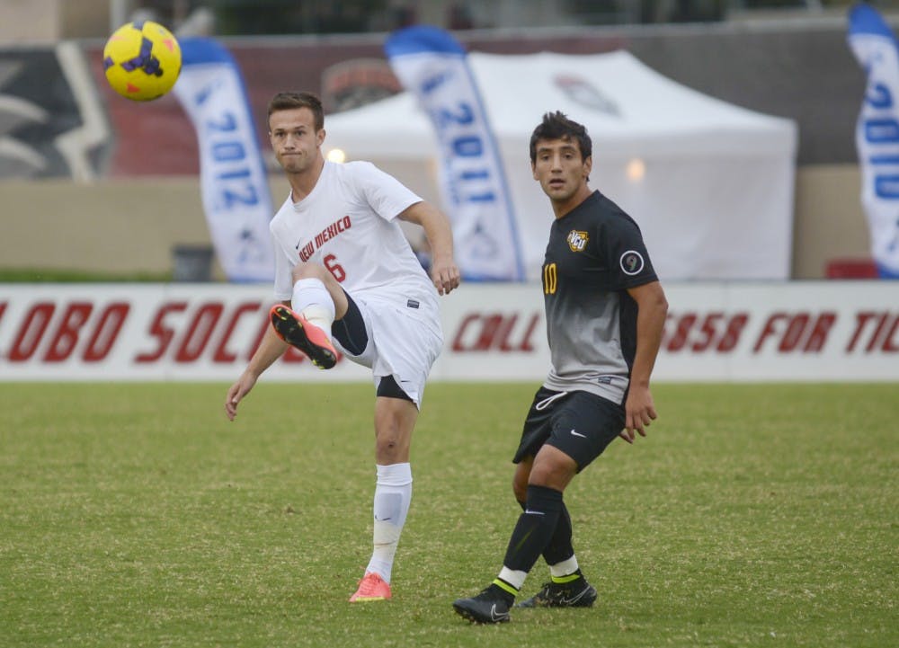 Lobo junior midfielder Ben McKendry kicks the ball away from VCU senior midfielder Mario Herrera Meraz during the game against VCU ar Lobo Soccer Complex on Sunday afternoon. The Lobos will be playing against Charlotte in North Carolina tonight at 7 p.m.