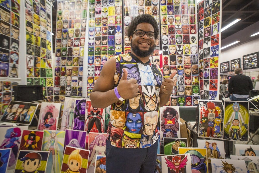 Terry Huddleston stands in front of his poster booth at the 2017 Albuquerque Comic Con on Saturday, Jan. 14, 2017. The convention was a three-day event that brought hundreds of vendors, artists, actors, musicians and authors to the Albuquerque Convention Center.