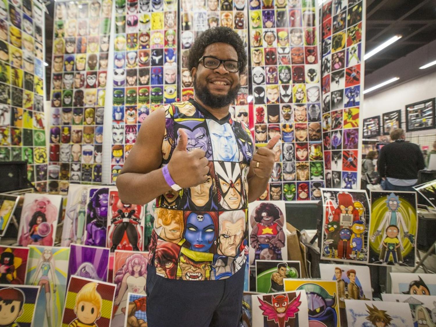 Terry Huddleston stands in front of his poster booth at the 2017 Albuquerque Comic Con on Saturday, Jan. 14, 2017. The convention was a three-day event that brought hundreds of vendors, artists, actors, musicians and authors to the Albuquerque Convention Center.
