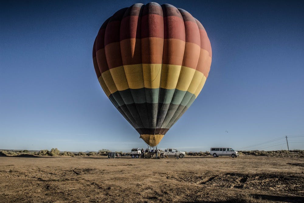 One of Air Carriage LLC's balloons, "Mas Fedia/More Cash," prepares to soar with eleven passengers, including pilot Arthur M?ller and a trio of sky divers on Oct. 17, 2017.
