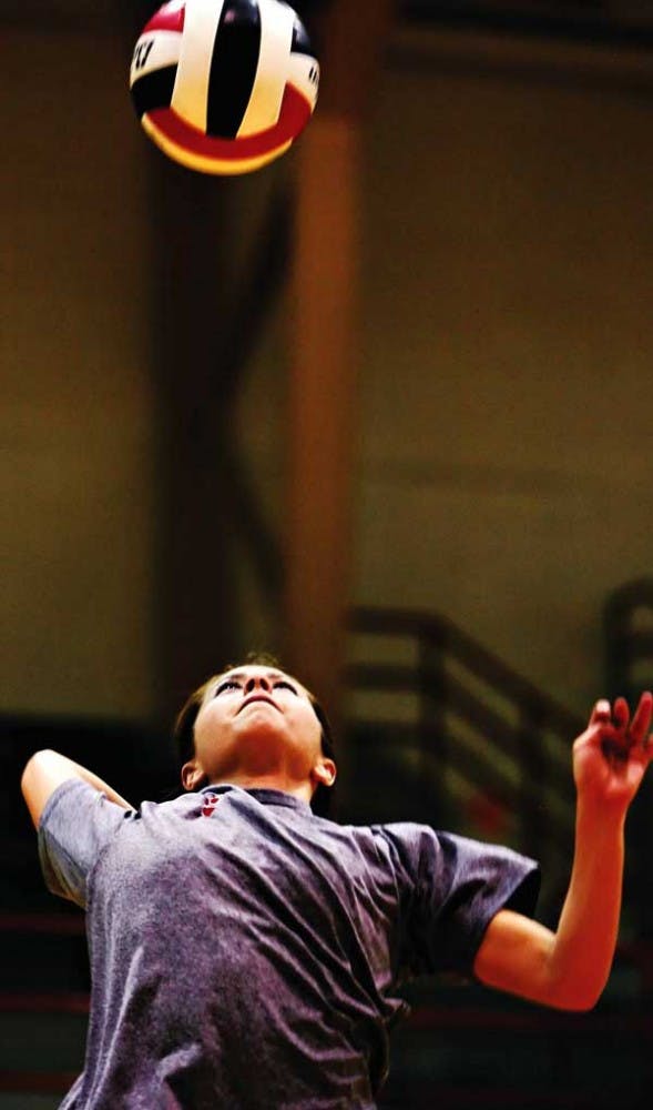 UNM's Gayle Tripp serves the ball during practice drills in Johnson Gym on Thursday. 
