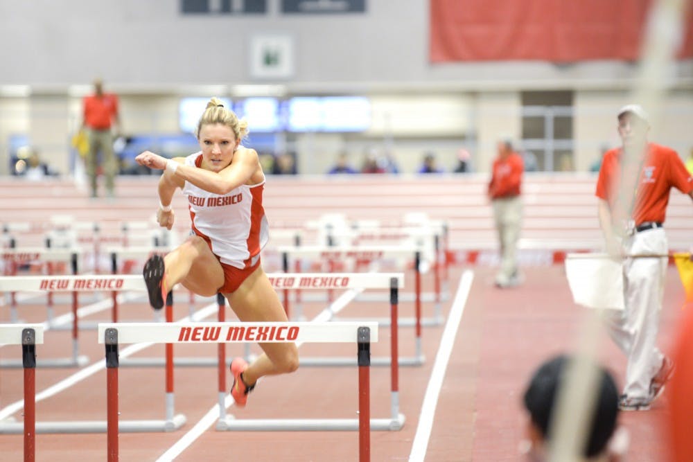 Senior sprinter/hurdler Holly Can Grinsven leaps over a hurdle at the Cherry and Silver Invitational Friday, Jan. 23, 2016 in the Convention Center. The Lobos will compete at the New Mexico Team Invitational this Saturday. 