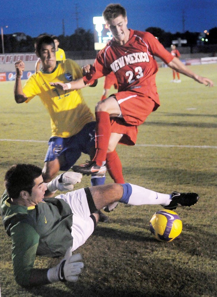 	UNM forward Blake Smith and Fort Lewis midfielder Cory Dean battle for the ball in front of Fort Lewis goalkeeper Ryan Wirth, in a 2-1 overtime victory for the Lobos on Aug. 27. UNM will play two nationally ranked opponents this weekend facing Georgetown on Friday and Portland on Sunday at UNM Soccer Complex.