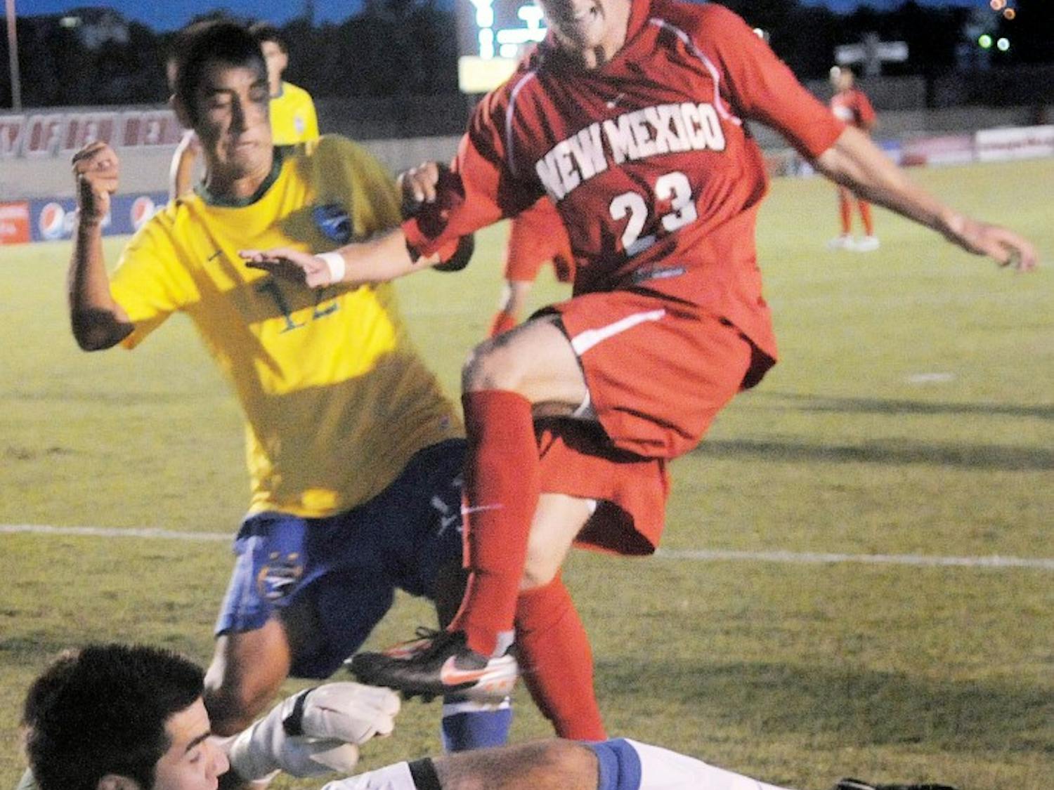 	UNM forward Blake Smith and Fort Lewis midfielder Cory Dean battle for the ball in front of Fort Lewis goalkeeper Ryan Wirth, in a 2-1 overtime victory for the Lobos on Aug. 27. UNM will play two nationally ranked opponents this weekend facing Georgetown on Friday and Portland on Sunday at UNM Soccer Complex.