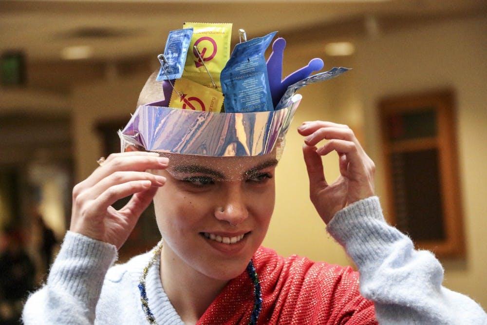 UNM student Sarah East wears a crown made from expired condoms during the Passion for Fashion event on Dec. 1, 2017.