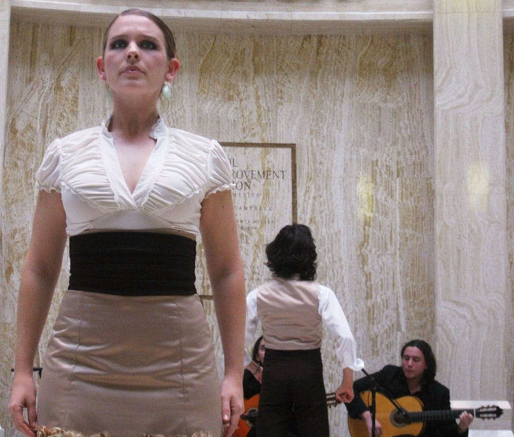 	Student Kayla Lyall prepares to dance flamenco at the Roundhouse Rotunda in Santa Fe on Monday. Fearing budget cuts, representatives from UNM traveled to the capitol as part of UNM Day to highlight programs, departments and services offered at the state’s flagship university.