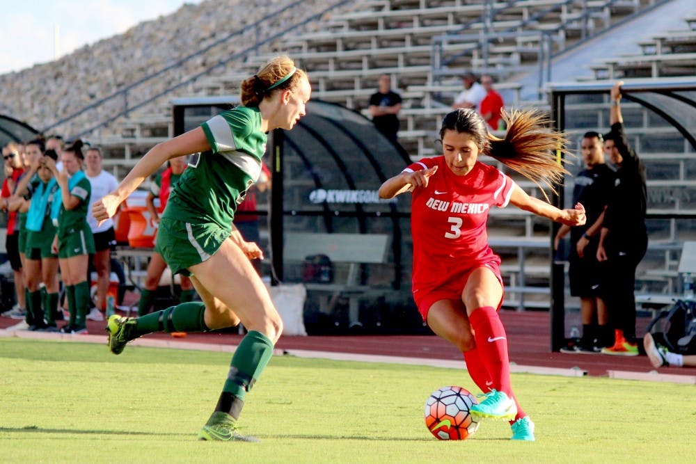 Lobo Midfielder Jennifer Munoz guards the ball from Eastern New Mexico University player Sunday evening during the exhibition game at the soccer complex. The Lobos won 2-1.