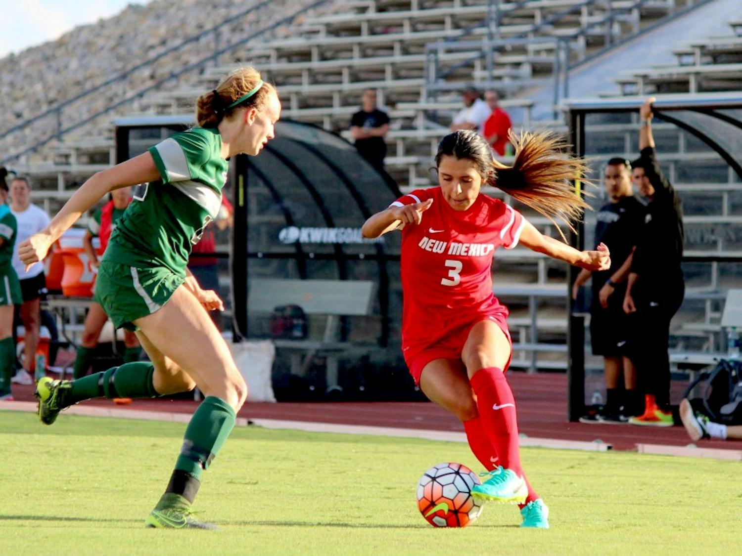 Lobo Midfielder Jennifer Munoz guards the ball from Eastern New Mexico University player Sunday evening during the exhibition game at the soccer complex. The Lobos won 2-1.