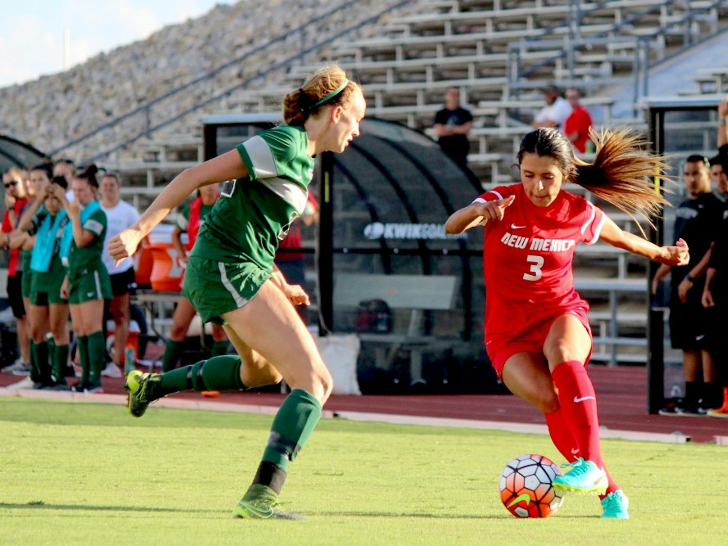 Lobo Midfielder Jennifer Munoz guards the ball from Eastern New Mexico University player Sunday evening during the exhibition game at the soccer complex. The Lobos won 2-1.