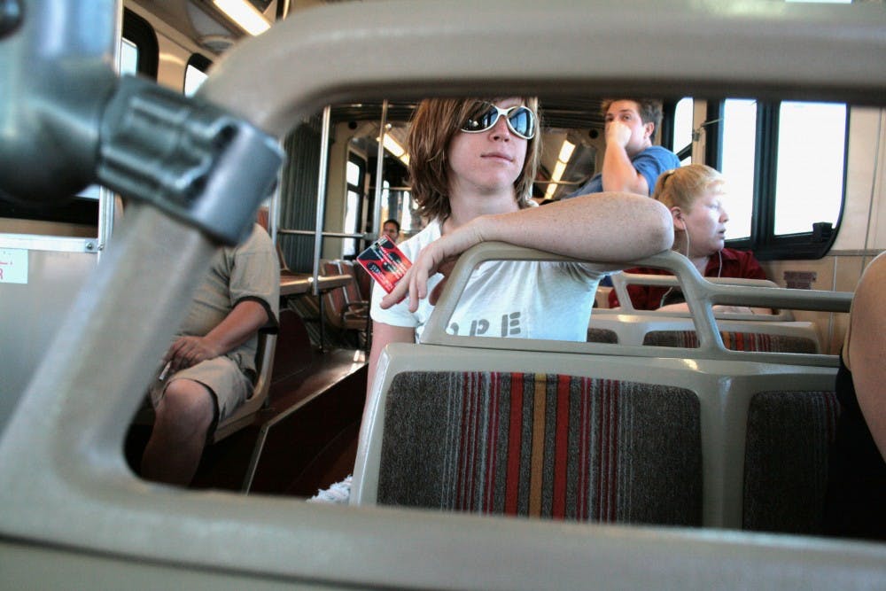 	UNM Student Stephanie Botsford rides ABQ Ride between campus and home. The Rio Metro Regional Transit District now offers free bus passes on ABQ Ride and Rapid Ride for those who commute on the Rail Runner.