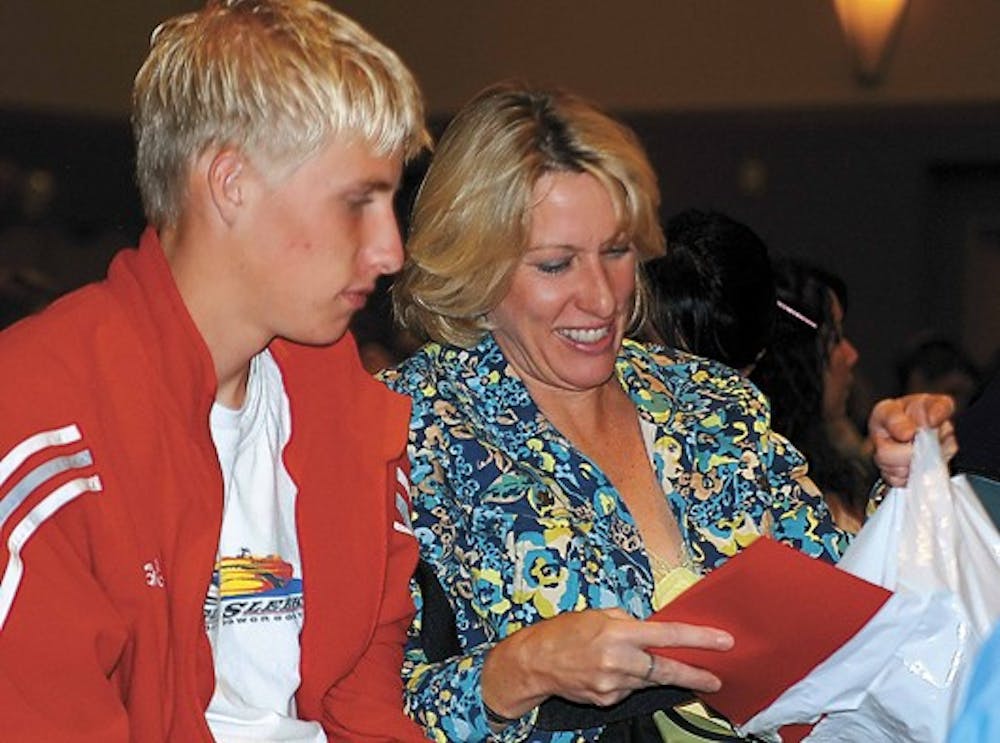 Cibola High School senior Ben Potter and his mother, Julie, attend UNM's Senior Day on Saturday.