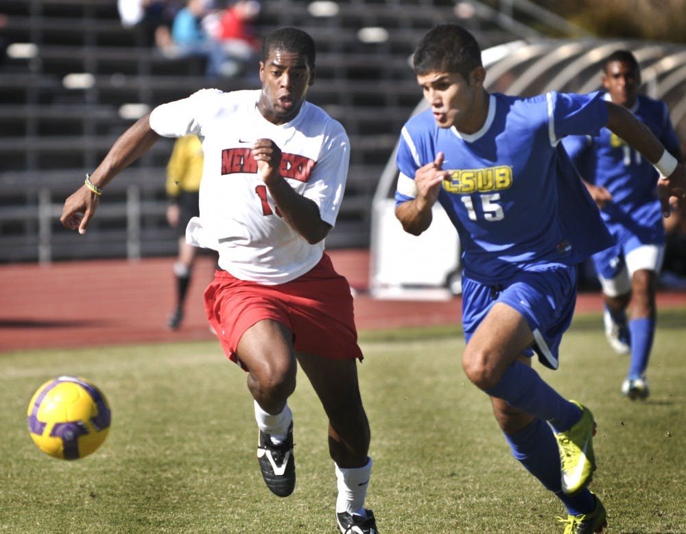 	UNM’s Michael Green and Cal-State Bakersfield’s Alberto Navarro fight for the ball Sunday at the UNM Soccer Complex. The match ended in a scoreless draw.