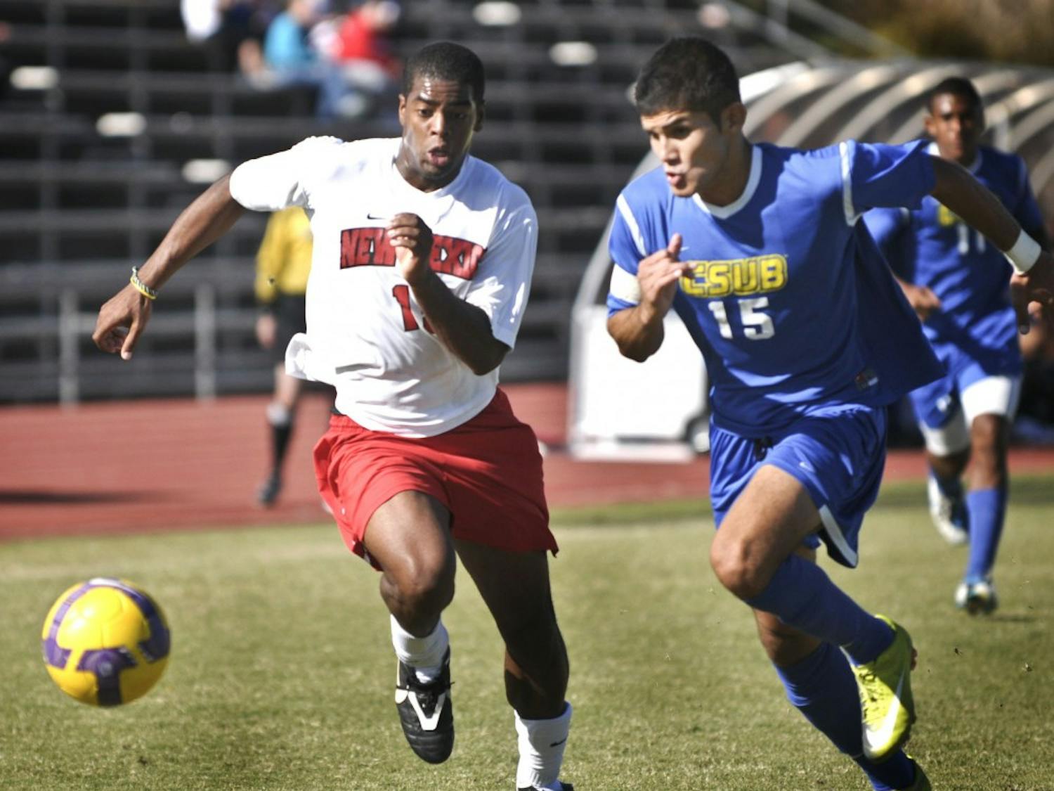 UNM’s Michael Green and Cal-State Bakersfield’s Alberto Navarro fight for the ball Sunday at the UNM Soccer Complex. The match ended in a scoreless draw.