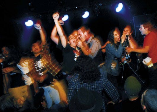 Punk band Angel City Outcasts performs a version of their self-titled song with audience members at the Launchpad on Monday.