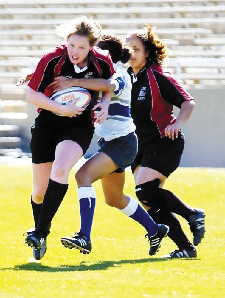 UNM flanker Jillion Potter lunges toward the goal while being tackled during Saturday's game against Air Force at University Stadium.