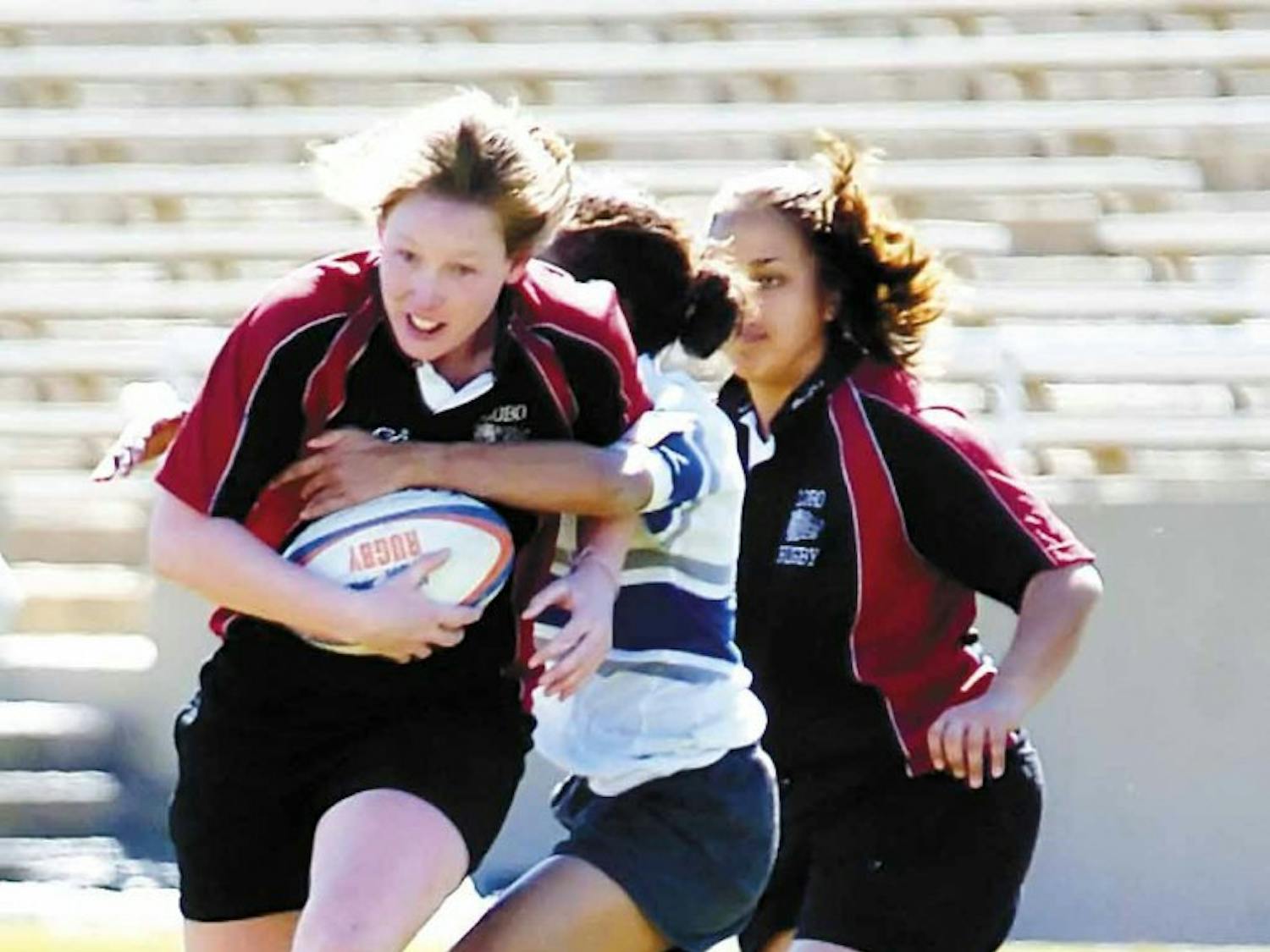 UNM flanker Jillion Potter lunges toward the goal while being tackled during Saturday's game against Air Force at University Stadium.