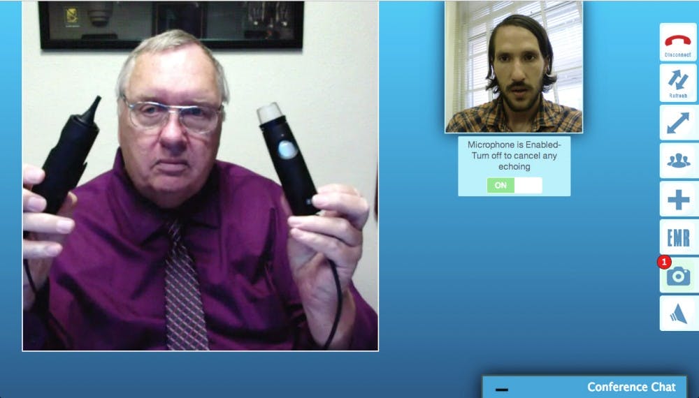 	During a live demonstration Tuesday with the Daily Lobo, Net Medical Xpress CEO Dick Govatski, left, shows how his company’s Telemedicine Intensive Care Unit Carts operate. The system allows doctors to remotely diagnose patients, using this interface. This screenshot was captured by Jonathan Baca.