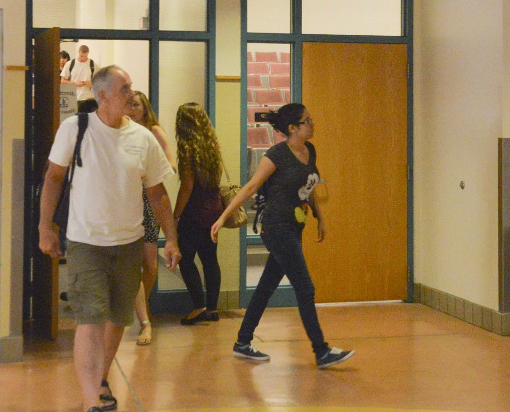 Students leave the classroom at the Dane Smith building on Tuesday afternoon. UNM officials said having supplies and looking through the materials before the semester begins is the best way to succeed.