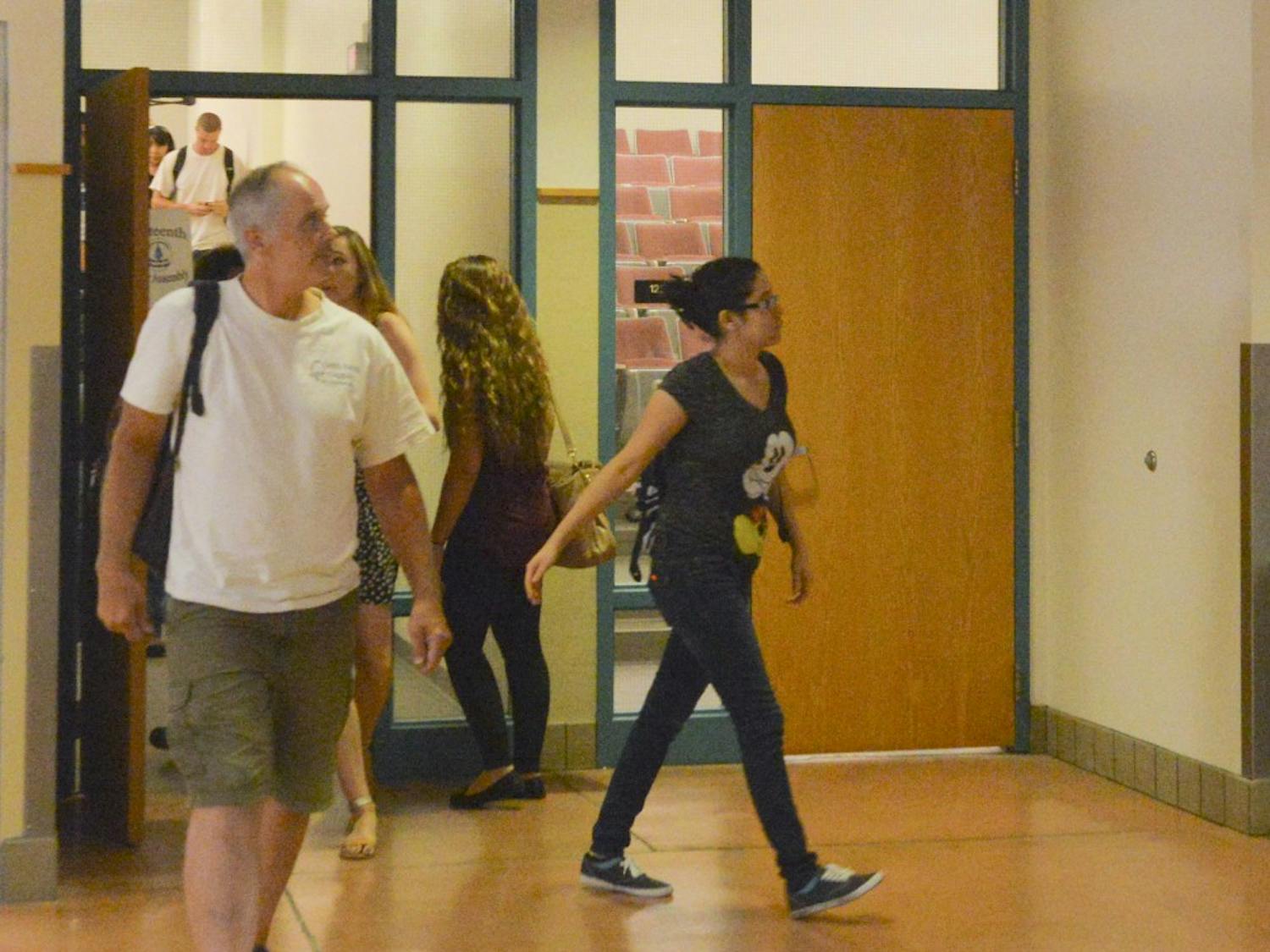 Students leave the classroom at the Dane Smith building on Tuesday afternoon. UNM officials said having supplies and looking through the materials before the semester begins is the best way to succeed.