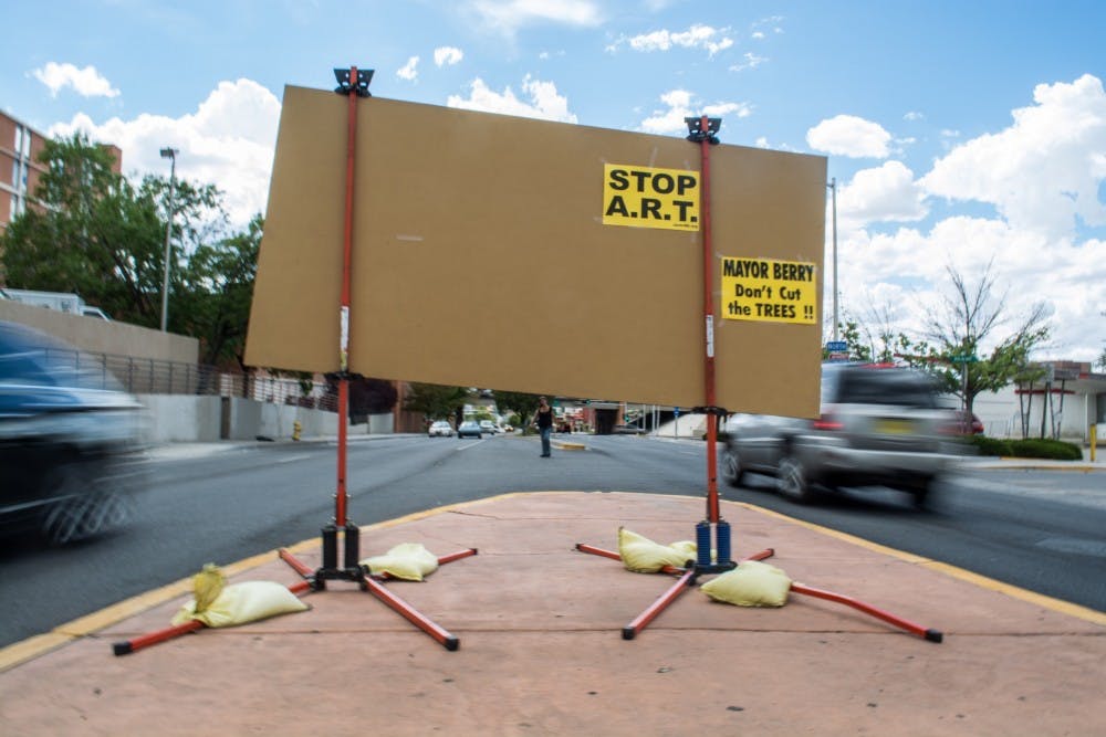 Flyers protesting the new Albuquerque Rapid Transit are posted on the back of a construction sign on Central Avenue&nbsp;Thursday afternoon. ART also has plans to use landscaping to help make the project more appealing.