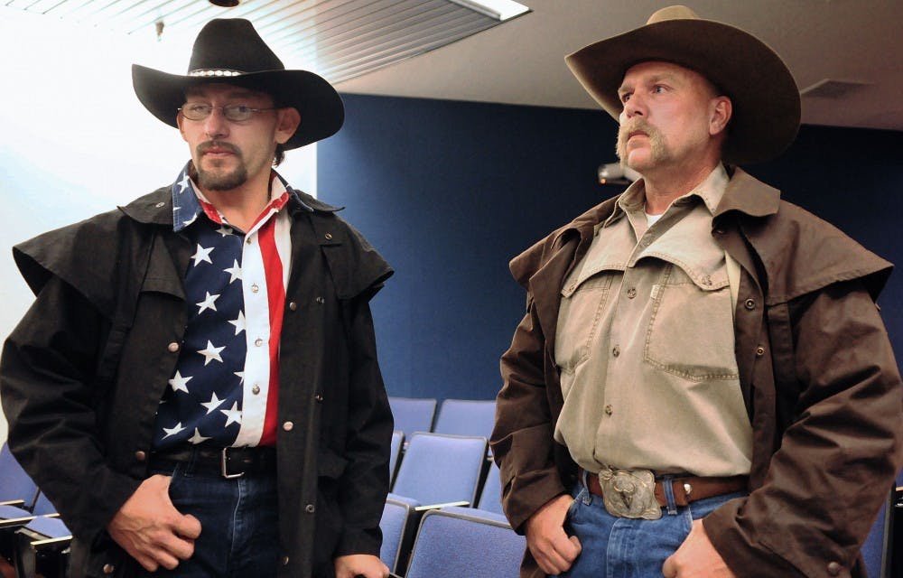 	Medical marijuana patient Jose Pacheco, left, and his friend Len Coleman stand in the Harold Runnels Building in Santa Fe after a Department of Health Medical Cannabis Advisory Committee meeting Friday. Pacheco attended the meeting to petition for cluster-type migraines to be added as a condition that qualifies for the Medical Cannabis Program.