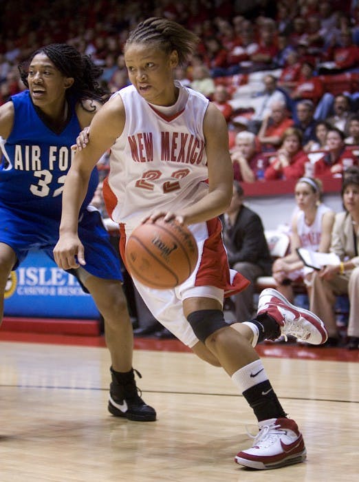 UNM guard Georonika Jackson drives past Air Force forward Alecia Steele on Wednesday at The Pit. Jackson scored 10 points in the Lobos 79-40 win over Air Force.