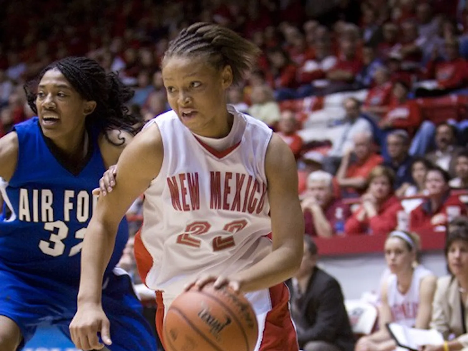 UNM guard Georonika Jackson drives past Air Force forward Alecia Steele on Wednesday at The Pit. Jackson scored 10 points in the Lobos 79-40 win over Air Force.