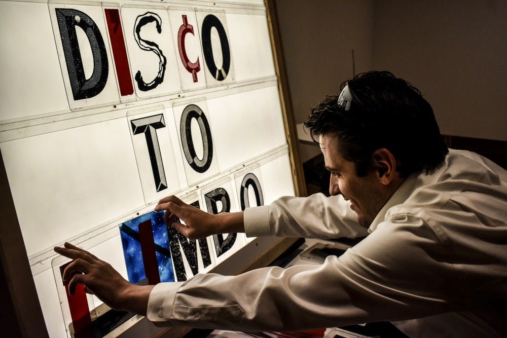 An art gallery attendee interacts with an exhibit at the University of New Mexico Art Museum on Sept. 19.