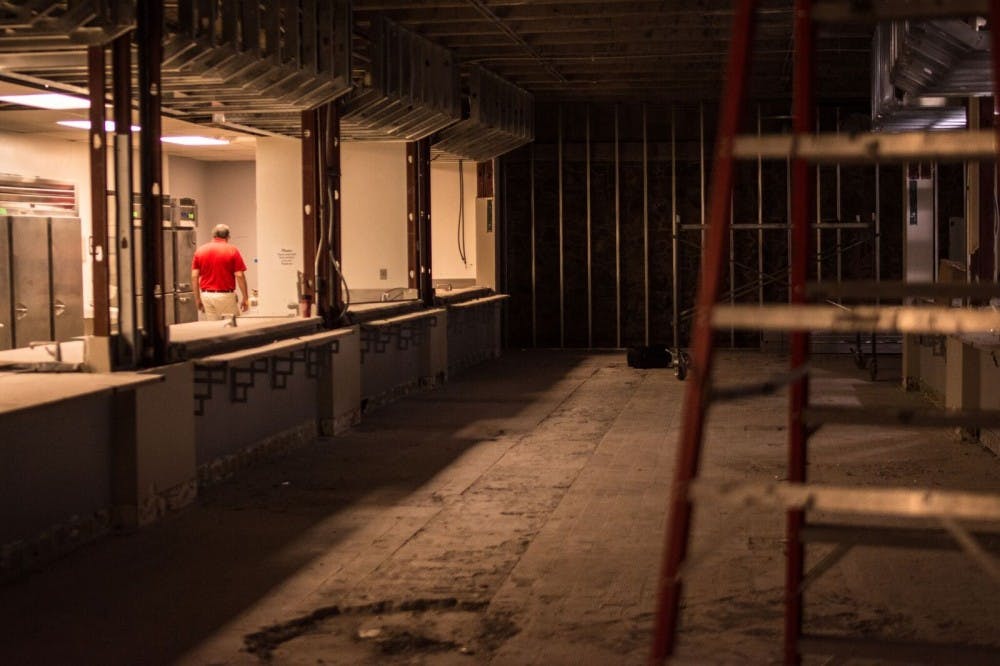 Paul Wilson-Scott, Resident District Manager of Chartwells, strolls through the food prep stations located in La Posada Dining Hall on Saturday June 24, 2017. The cafeteria adjacent to many UNM dormitories is undergoing a summer&nbsp;long renovation.