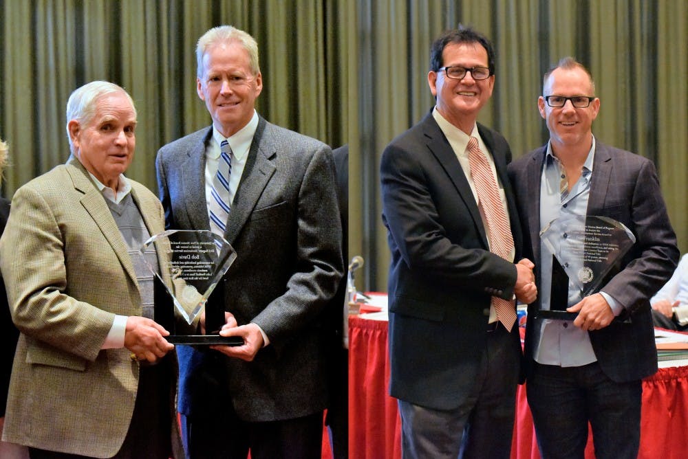 Football head coach Bob Davie(left) and cross country head coach Joe Franklin honored at Friday's board of regents meeting at the SUB.&nbsp;