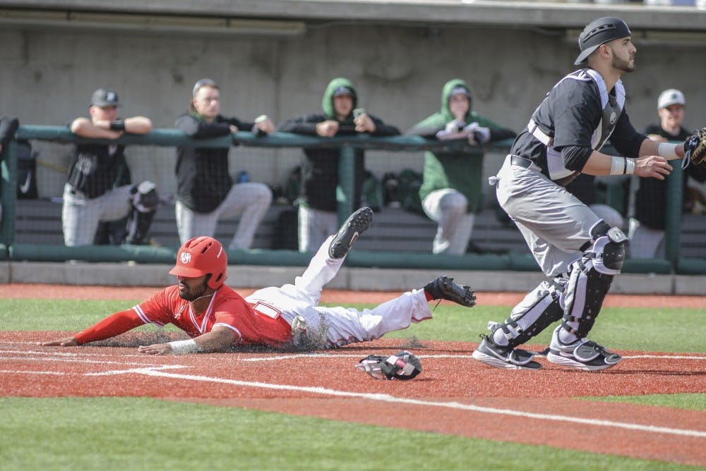 Senior Andre Vigil slides into home plate during the Lobos' last game against Binghamton on Sunday, Feb. 19, 2017 at Santa Ana Star Field. The Lobos swept Binghamton, winning all three games in the series this past weekend.