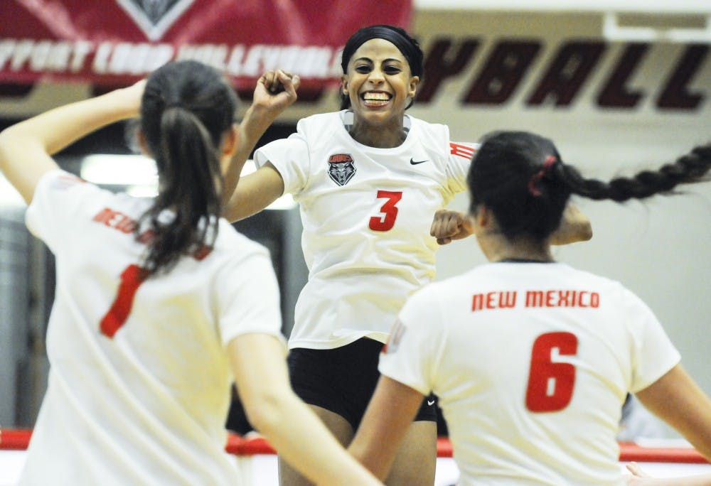 New Mexico right side hitter senior Chantale Riddle cheers after scoring on Tuesday night at Johnson Gym against Air Force. Riddle captured the Mountain West all-time career kill record on senior night. 