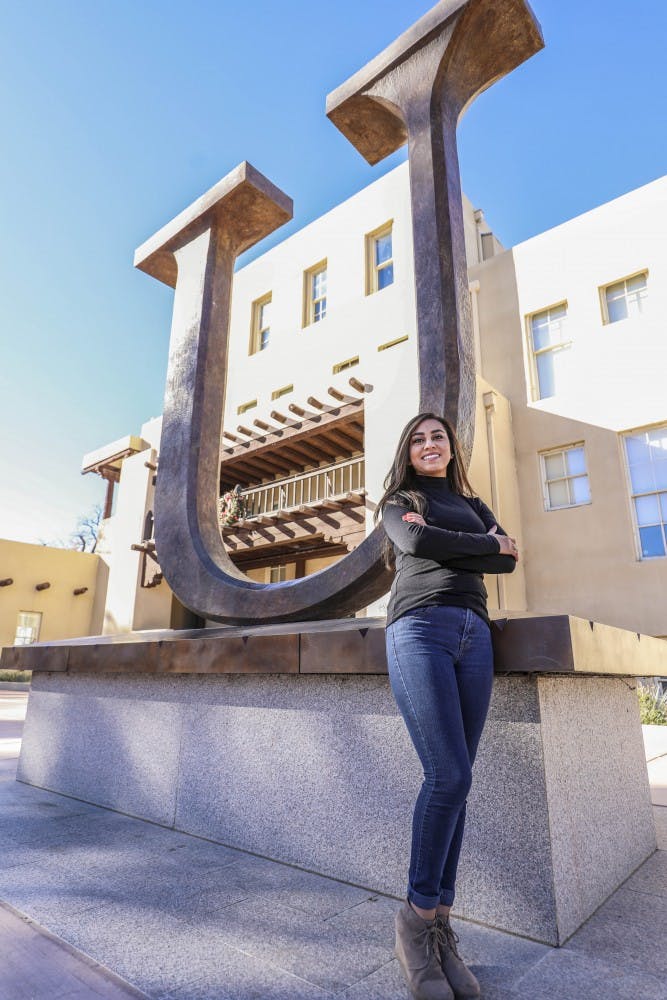 Julieann Lopez stands near Hodgin Hall. She will be receiving her Bachelor of Science in exercise science and a minor in psychology.