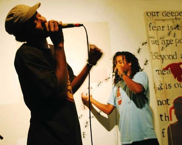 Tr&eacute; Hardson, left, and Fatlip, formerly of the Pharcyde, perform to about 100 people at Stove Gallery on Sunday.